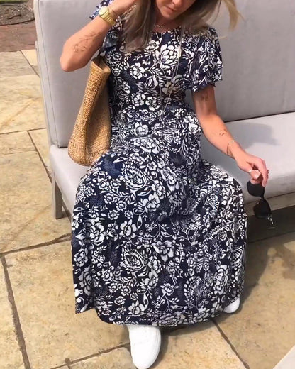Van Elst Mode® | Lange jurk met korte mouwen en bloemenprint